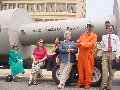 Mile 520--Mock Nuclear Waste Roadshow: Members of Triad Environmental Action pose near the cask after press conference in Winston-Salem.